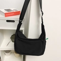 Black large capacity nylon messenger bag with adjustable shoulder strap and utility pockets - Black