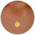 Gold coin necklace with green gemstone and starburst design on delicate chain - Geometric Sun Necklace