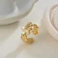 Macro shot of gold-plated open ring with detailed 3D floral daisy embossed pattern - Adjustable Open / Gold Daisy Relief (R446) / Gold