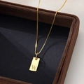 Elegant gold square necklace with letter W pendant on dark brown velvet box - Letter W / Gold