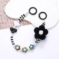 Handmade beaded phone strap featuring a black plush yarn flower and heart-shaped beads - Black Flower Style (K2662)