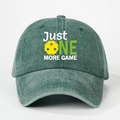 Detail of washed cotton baseball cap with JUST ONE MORE GAME print and pickleball graphic - Dark Green