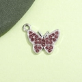 Macro di un ciondolo a farfalla d'argento con strass rosa per creazione di gioielli fai da te - Farfalla Viola Chiaro Placcata Argento UV