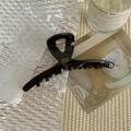 Detailed macro view of handmade chocolate acetate hair claw clip with gold spring - 11cm Cross