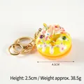 Bright yellow resin donut keychain with white cream and colorful sprinkles on a white base - D14 Yellow - Gold 8-clasp