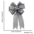 Close-up of black gauze Halloween bow with skull patterns and integrated LED lights - Style D (Colored Light)