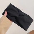 Gros plan du bandeau large torsadé noir avec texture tricotée douce à la main - Noir