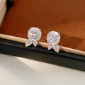 Macro shot of silver leaf earrings with a large round zircon and pave leaf details - Silver Rose Style (White Zircon) / Silver-White