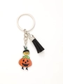 Detail of acrylic Halloween girl keychain with black tassel and secure metal clip - Girl in Pumpkin Suit (20624)