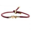 Adjustable woven cord bracelet in dark red featuring double golden heart pendants - Pink Heart