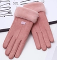 Close-up of pink faux suede winter gloves with fluffy fur cuffs and leather fashion label - One Size / Pink (Center Line)