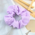 Detail of purple elastic scrunchie with silver rhinestones on a lifestyle background - Purple