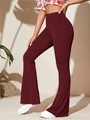 Side view of high-waist wine red ribbed knit flare yoga pants with elegant drape - S / Bottoms / Burgundy