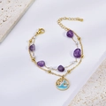 Detail of gold starfish anklet with purple natural stone and ocean wave round charm - Bracelet