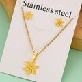 Detailed view of golden stainless steel flower pendant necklace and earring set on card - Six-Petal Flower Set