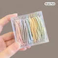 Pack of 50 elastic spiral hair ties in macaron colors stored in a transparent box - Multicolor 4