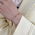 Fashionable golden bracelet with colorful square crystal beads worn on a wrist - Single Layer Crystal Cube (Bracelet)