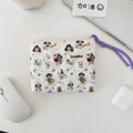 Quilted floral makeup bag with dog patterns on office desk near laptop and earphone - Cartoon Dog
