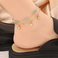 Bohemian gold double layer anklet with turquoise beads and white star pendants on model - Star Shape