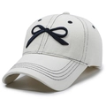 Off-white washed denim baseball cap featuring a contrast navy blue bow and topstitching - Adjustable / White