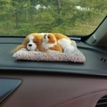 Close-up of realistic plush sleeping dogs on a gray mat on a car dashboard decoration - Charlie Spaniel Parent-Child Sitting Set
