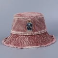 Close-up of embroidered bear patch and distressed fringe on burgundy denim bucket hat - M (56-58cm) / Red