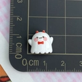 Mini glossy white resin ghost charm with red bowtie measured on a grid cutting mat - Red Horns Mini