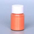 Pearlescent orange mica powder in a small clear bottle for DIY crafts and resin - Pearl Powder #36 Orange