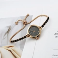 Women's gold quartz watch with minimalist black dial and gemstone bracelet strap - Black