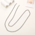 Detail of silver metal crossbody chain strap with lobster clasps on cream background - Silver 7.5mm Crossbody Chain