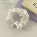 Close-up of white satin scrunchie with pearl-like luster in a French style aesthetic - No Card / White