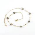 Minimalist gold chain necklace featuring crystal flower charms and faceted gray beads - White K Color - Necklace