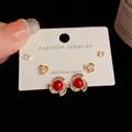Three-pair gold earring set with red beads, zircons and S925 silver needles on white card - Gold-Rhinestone Rotating Pearl Set (44#)
