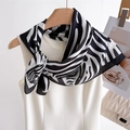 Fashionable zebra print silk scarf tied on white top against a minimalist studio background - 70x70cm / Red Zebra (FJ966-2)