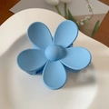 Matte sky blue flower hair claw clip with a five-petal design on a white ceramic plate - 7cm / Blue