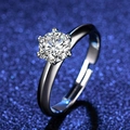 Macro shot of a classic six-prong silver ring with a brilliant round-cut cubic zirconia - Adjustable / One Carat Women's Ring PT950 Stamp