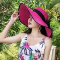 Rose red wide brim straw hat with wavy edges and a large black ribbon bow detail - One Size / Rose Red with Black Trim