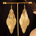 Detail of tiered golden leaf tassels with dotted texture on vintage long earrings - Long Textured Leaf / Gold