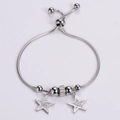 Bracciale regolabile in acciaio argento con ciondoli a stella e strass lucidi - Color Acciaio