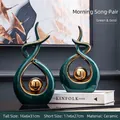 Modern emerald green ceramic sculpture set with gold trim for living room decor - Green Gold Abstract Pair