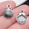 Ciondoli a conchiglia in lega d'argento per gioielli fai-da-te, vista fronte e retro - Conchiglia in Argento Antico (11×14mm)