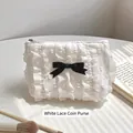 Elegant white lace coin purse with black bow detail and ruffled texture for women - Bell Coin Purse / White