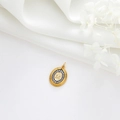 Macro detail of gold oval pendant with letter M, sunburst frame and white crystals - Vintage Oval Letter M Sunburst Style (H-8616)