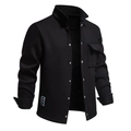 Close-up of waffle knit texture and chest pocket on a black fleece-lined jacket - Black