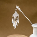 Close-up of silver hollowed fan hairpin with tassels placed in a white ceramic vase - Elegant Fan Hollow Tassel (F370)