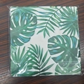 Hawaiian party napkins featuring green monstera and palm leaf patterns in plastic wrap - Hawaii Leaves (Monstera Palm Leaf Pack)
