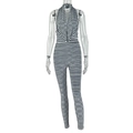 Close-up of black and white striped halter jumpsuit with cowl neck and side ruching details - S / Black+White