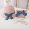 Detail of pink woven straw hat and matching purse with denim bow and handmade label - Kids 54cm (4-9 Years) / Hat + Bag Set / Pink