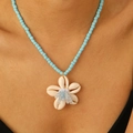 Bohemian anklet with sky blue beads and natural white shell flower pendant on model - Blue Bead Shell Flower Necklace / Blue