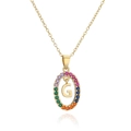 Detailed macro of gold plated necklace with rainbow zircon halo and G letter pendant - Letter G